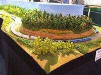 Quad Locos Haul Their Train Around Bend Through Large Cutting